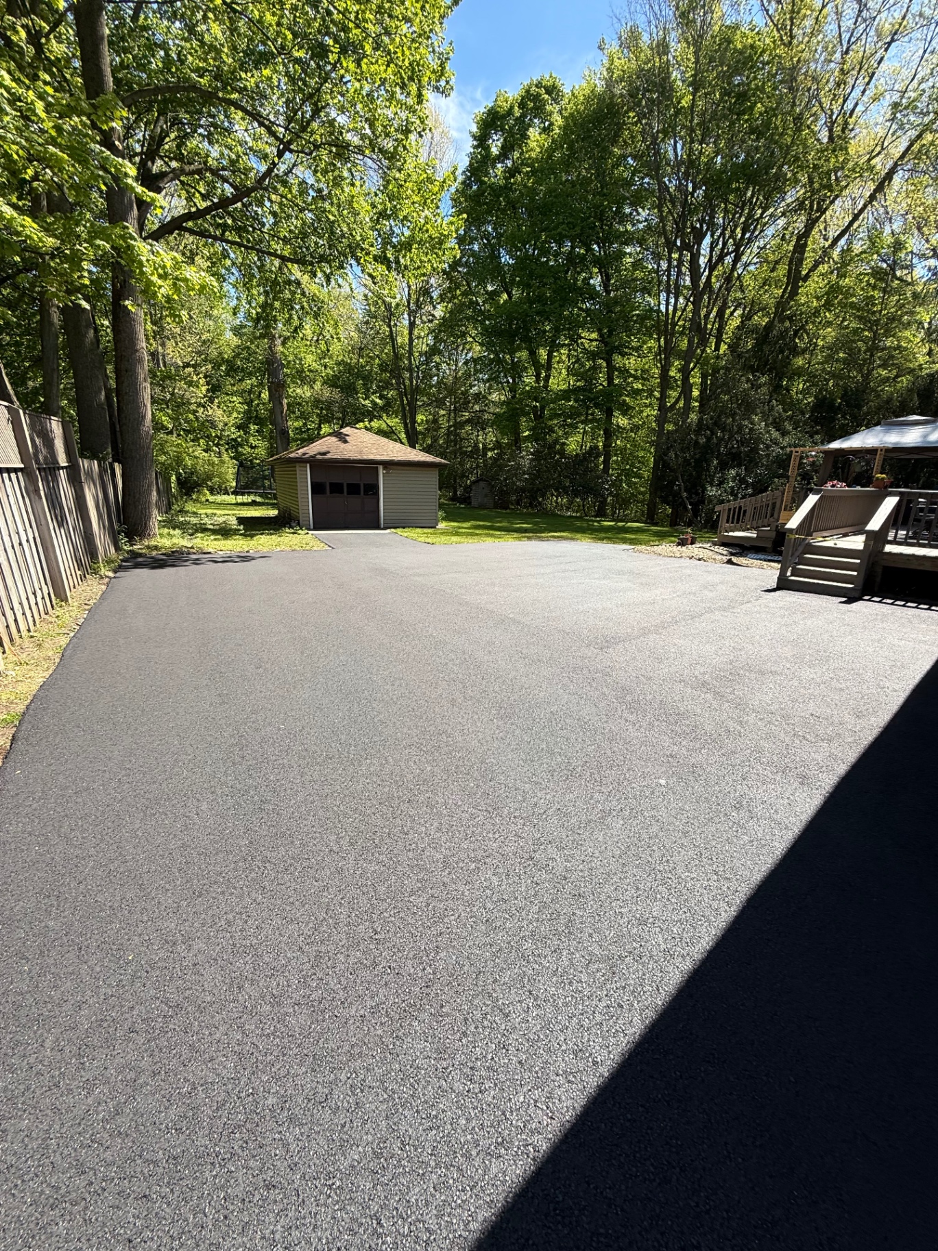 Asphalt resurfacing leading to detached garage