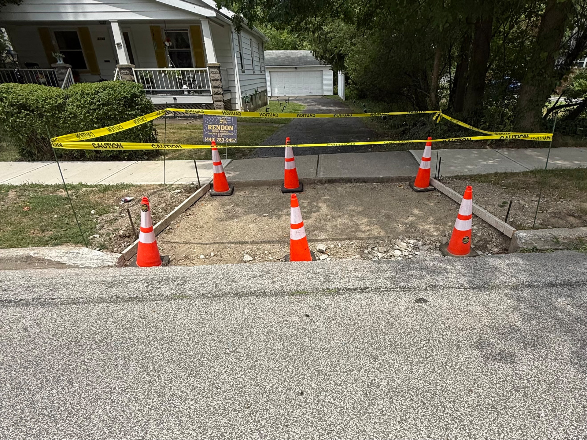 Before: concrete driveway apron replacement in South Euclid, OH, cracked, deteriorated concrete