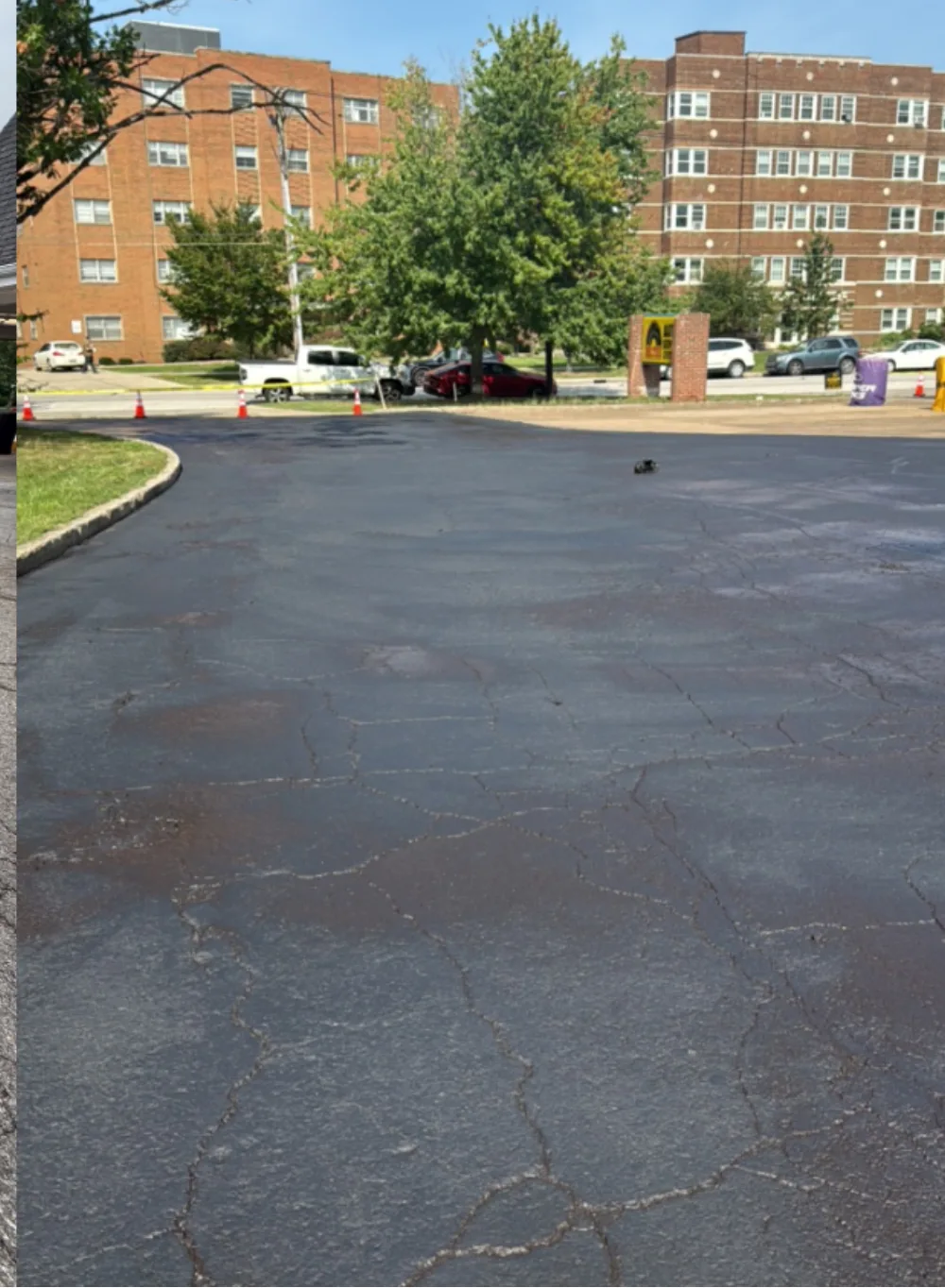 Sealcoated main customer parking area at a Mr. Tire auto service center in Lakewood, Ohio