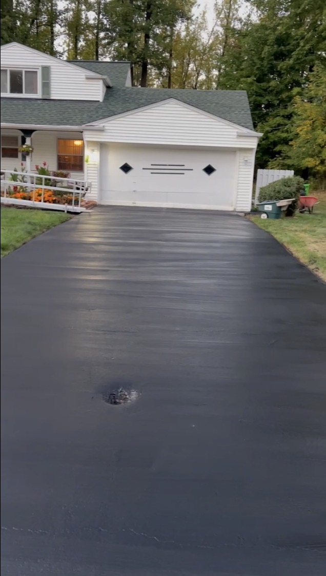 Freshly sealcoated asphalt driveway