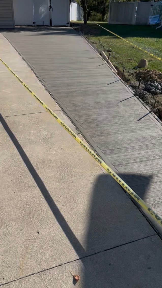 New concrete driveway with broom finish